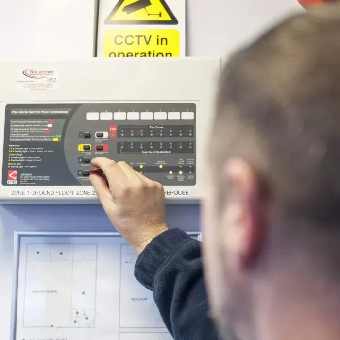 Engineer installing Longtek fire alarm system